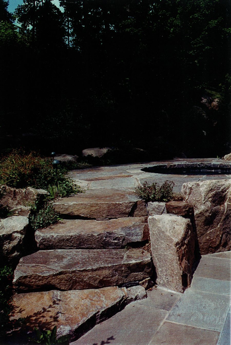Natural stone steps and pool water feature