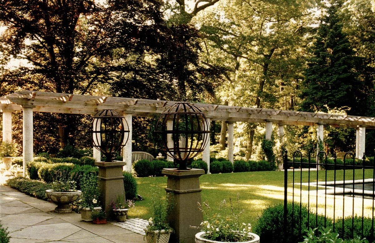 Formal estate garden with stone pergola and pathway